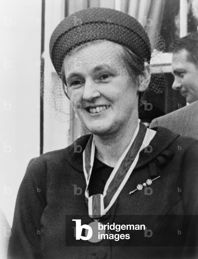 Dr. Frances O. Kelsey, wearing the Distinguished Federal Civilian Service medal awarded to her for preventing U.S. distribution of the sedative Thalidomide, which caused thousands of severe birth defects in Europe. August 8, 1962