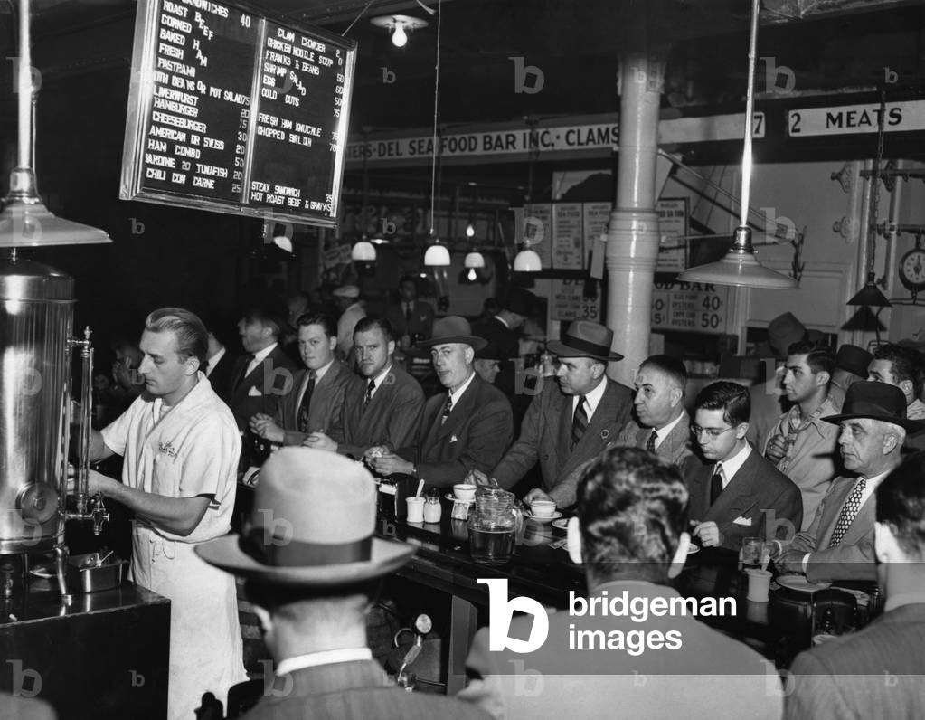 Businessmen eating at Pete's Bar in Washington Market, New York City, 1950