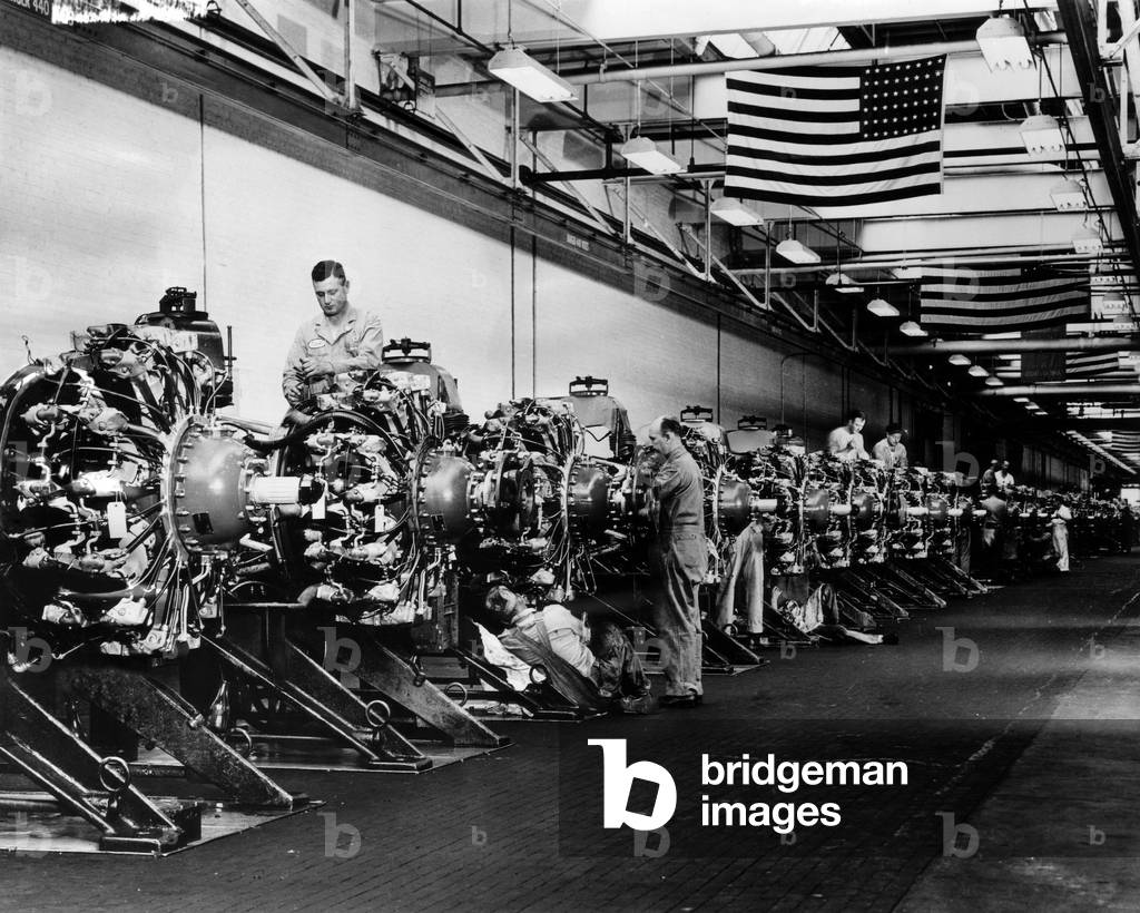 Men prepare engines for the B-24 Liberator bomber airplane at a Buick plant, 1943