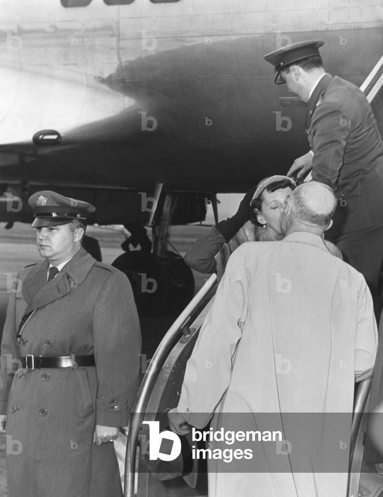 President Eisenhower kisses First Lady Mamie upon her return from Phoenix, Arizona. March 11, 1958.