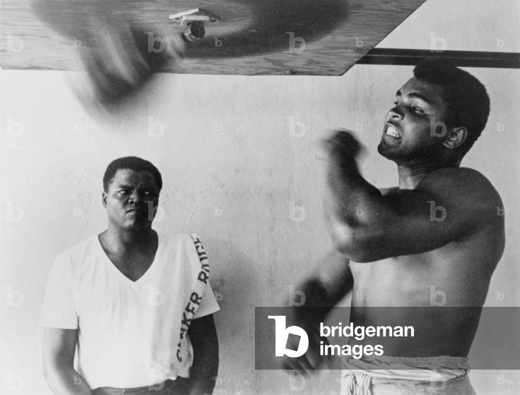 Muhammad Ali, works out on light bag in Miami, Florida. 1965