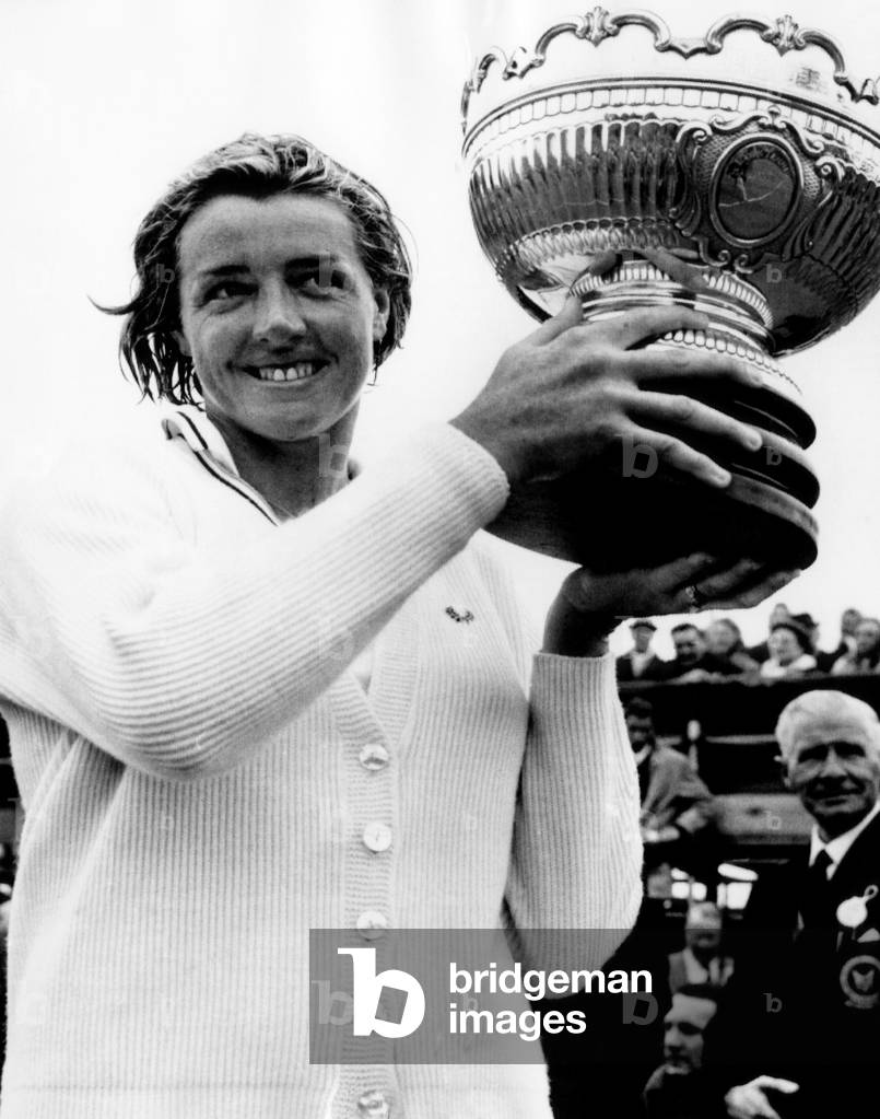Australian Tennis player Margaret Court hold up British Hard Courts trophy after defeating Vinnie Shaw of Great Britian in women's singles. 5/3/69.