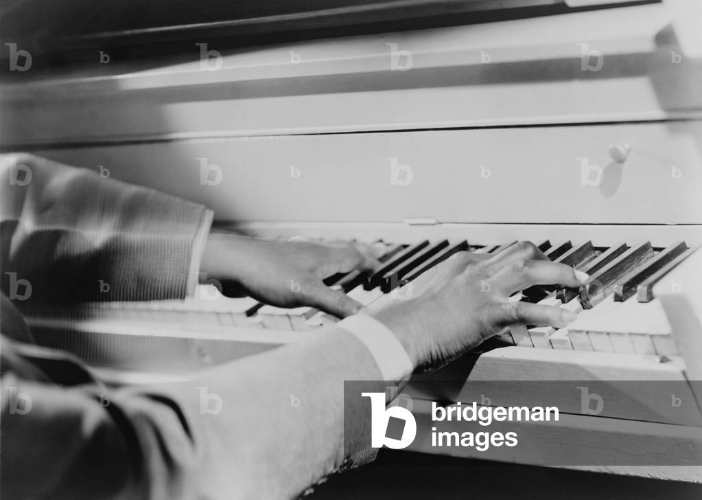The magic fingers of Art Tatum (1909-1956), African American virtuoso jazz pianist. Tatum, a blind musician influenced other jazz greats. 1951
