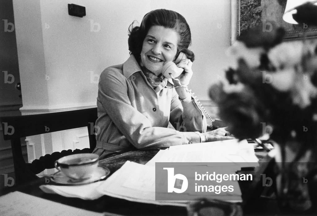 Betty Ford works at her desk situated in the First Lady's Dressing Room White House. 1974-76