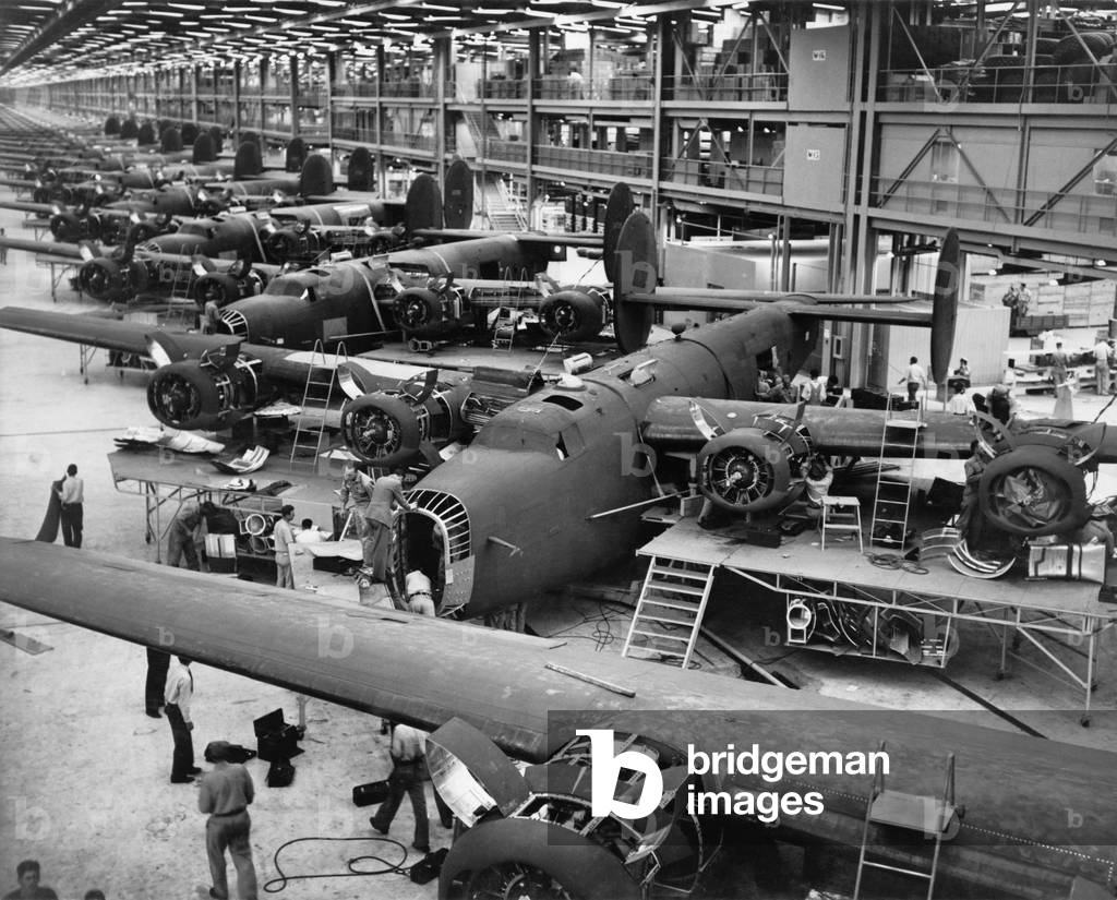 B-24 Liberator bombers nearing completion on the assembly line at the Consolidated Aircraft Corporation plant, Fort Worth, Texas. 1942
