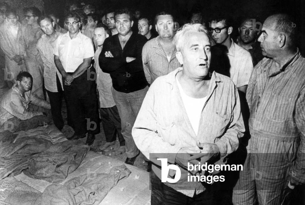 Police Captain Frank Wald (second from right), telling newsmen that he and other guards held as hostages at Attica prison by rebellious inmates were treated fairly by their captors, New York, September 11, 1971
