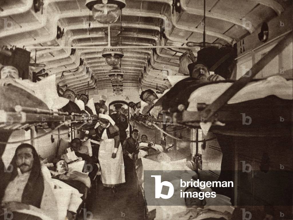 British WW1 wounded evacuated from France in a hospital train. 1914-18. Ambulances will transfer them to the base hospital