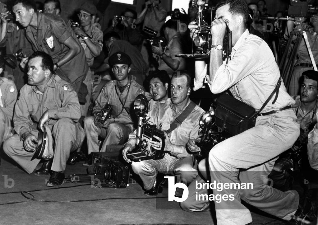 U.N. correspondents and photographers at the armistice building, Panmunjom, Korea. July 23, 1953. Korean War, 1950-53