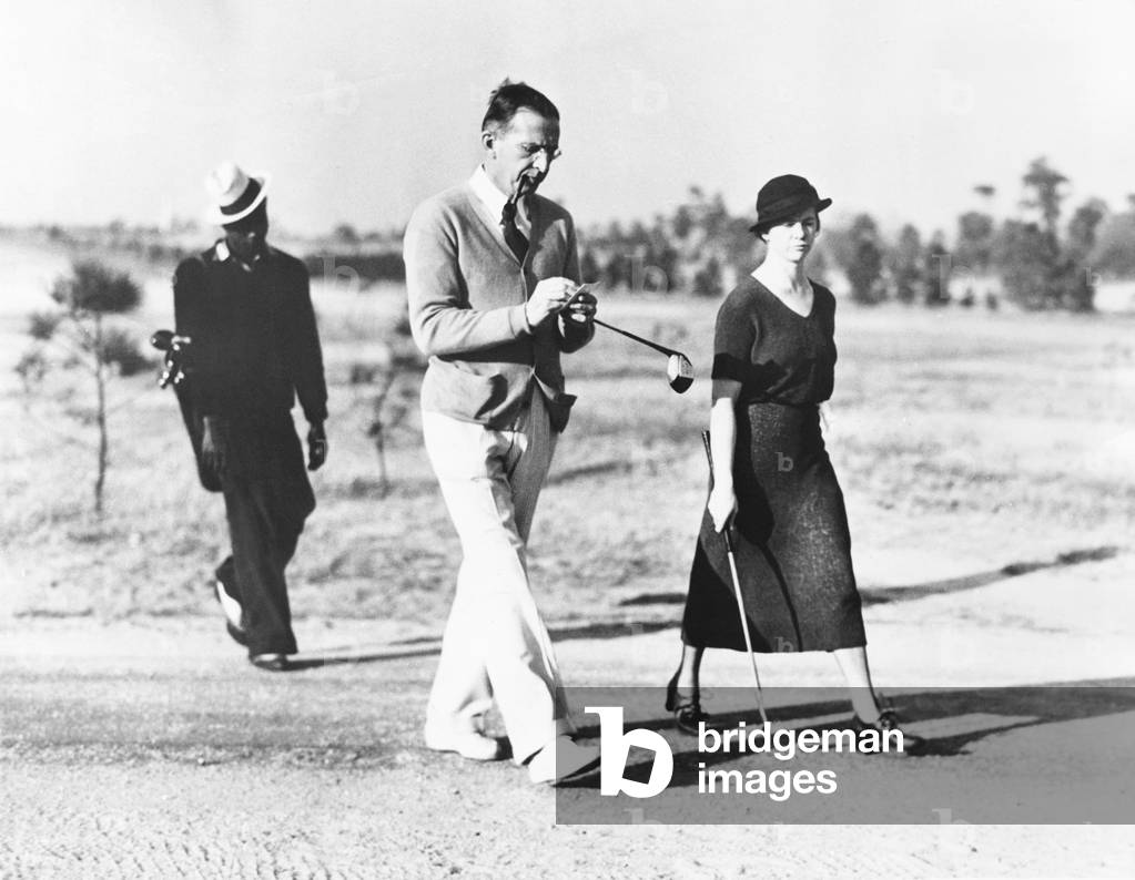 Lammot DuPont and his new bride and 4th wife, Margaret A. Flett. They played a round of golf on their honeymoon at Pinehurst, N.C. DuPont was Chairman of the Board of Directors of General Motors. Dec. 4, 1933. -