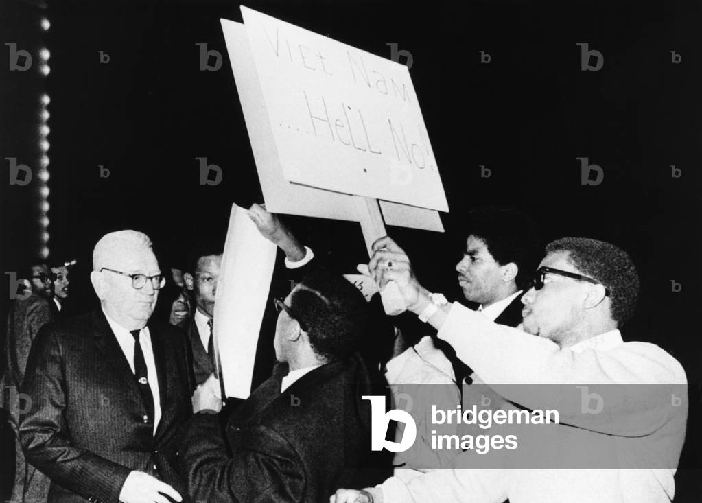Draft Director Louis Hershey driven from the stage by anti-war protestors at Howard University. March 21, 1967. 50 African American students surrounded the 73 year old Gen. Hershey waving anti-draft posters