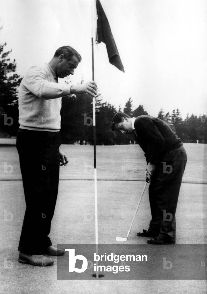 Joe DiMaggio and his son, Joe Jr., play golf in San Francisco, 1956