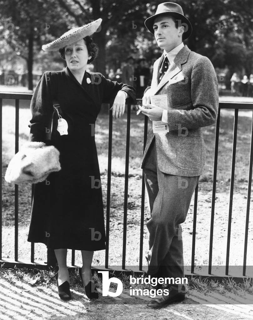 Gloria Swanson, attended the races at Belmont Park, NYC, Long Island on Sept. 24, 1938. The 39 year old actress was escorted by an handsome young man, Ira Richards, Jr