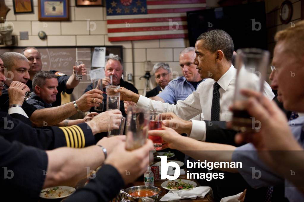 President Barack Obama and 'Pride of Midtown' firefighters toast at lunch on May 5, 2011. Engine 54, Ladder 4, Battalion 9 Firehouse in New York City lost 15 firefighters on 9/11 -- an entire shift and more than any other New York firehouse