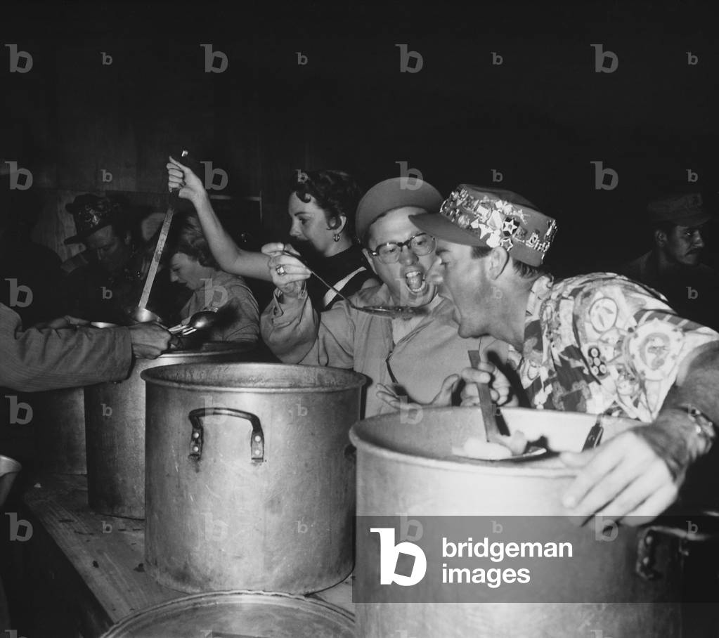 Mickey Rooney and members of his USO Troupe feed troops chow. R-L: Dick Winslow, Mickey Rooney, Deenah Prince, Alice Tyrrell, Red Barry. Oct. 12, 1952