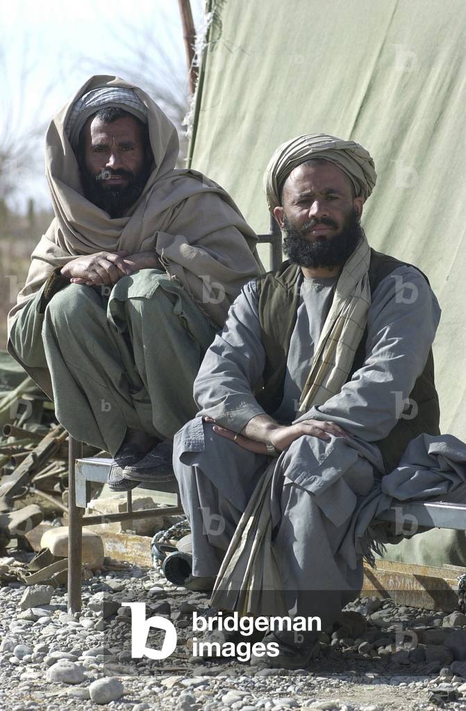 Southern Alliance fighters outside the Kandahar International Airport during the first months after the al Qaeda 9/11 terrorist attacks. Jan. 14 2002., Photo by:Everett Collection