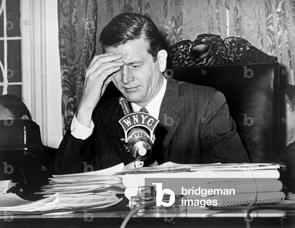 Mayor John Lindsay, speaking into WNYC radio microphone, during a public budget hearing. Feb. 16, 1966