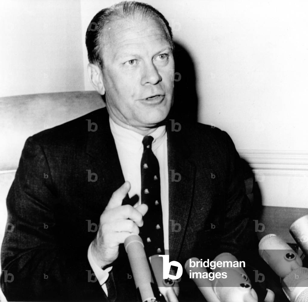 Congressman Gerld R. Ford at a press conference defending the U.S. bombing of missile bases in North Vietnam, July 7, 1965