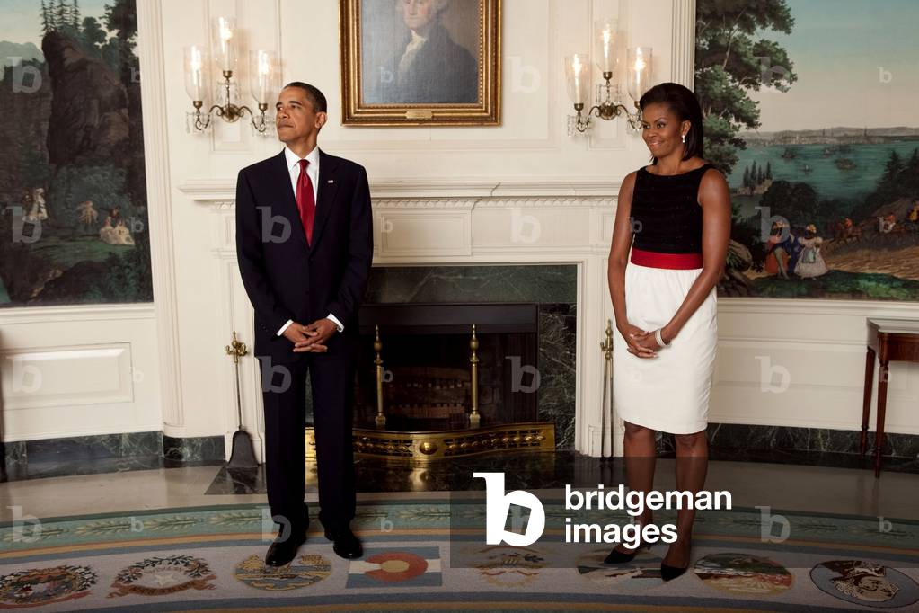 President and Michelle before the start of a receiving line at the Ambassadors Reception on July 27 2009. Michelle wears a color block dress by Jason Wu.,