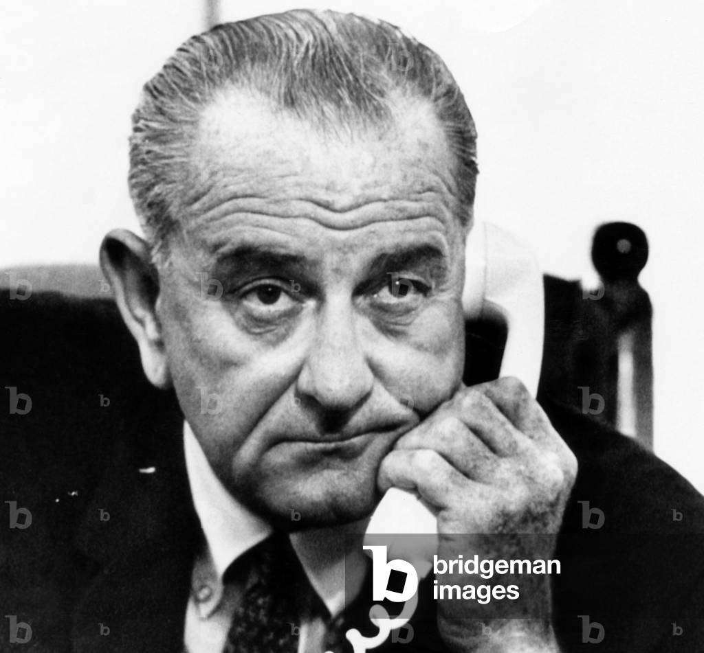 President Lyndon B. Johnson on the phone in the White House with Dr. William Pickering receiving a report about the Mariner-4 space mission. July 15, 1965.