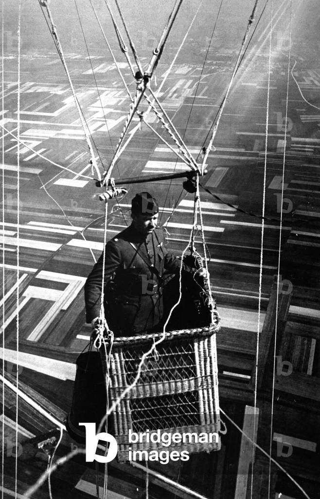 Close-up view of an American major in the basket of an observation balloon over territory near the World War I front lines. France. June 1918