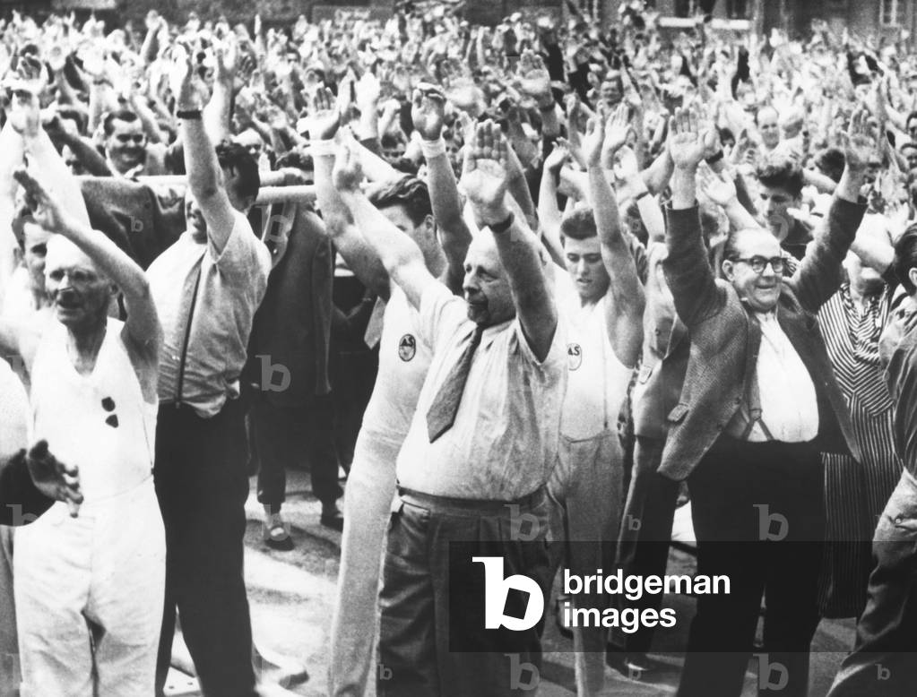 East German Communist President Walter Ulbricht (center, wearing necktie) leading a mass exercise. Aug. 20, 1959. They were celebrating the opening of a new sports field in Leipzig built with 1850 hours of volunteer labor