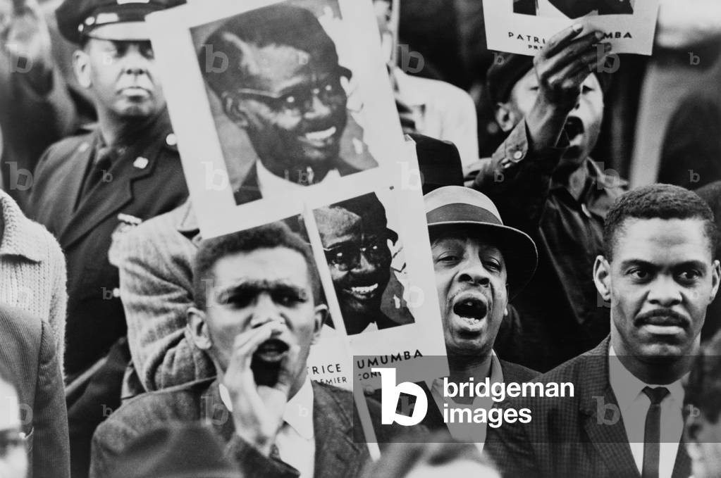 African American men at a Black Muslim demonstration carrying placards with portrait of Patrice Lumumba, Premier of Congo. Lumumba was executed on Jan. 17, 1961. Both the US and Belgian were acting to kill Lumumba, with the Belgians succeeding assisted by Congolese partners