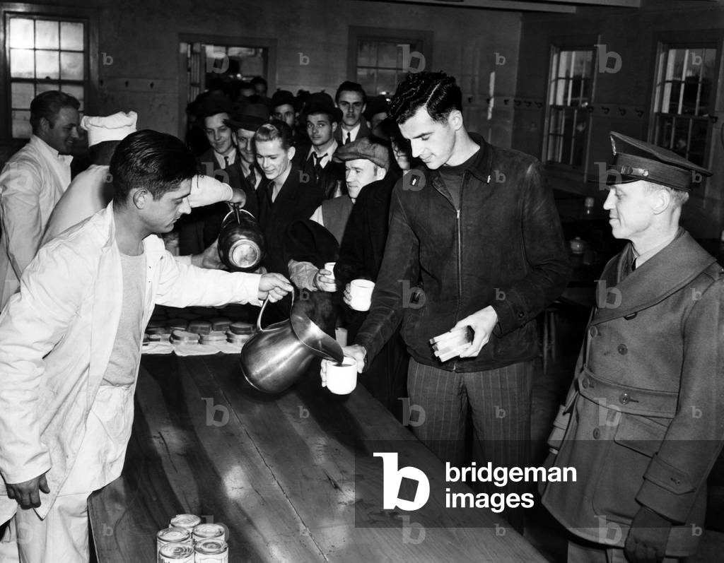 Chicago draftees line up to taste their first Army food after their arrival at Fort Sheridan, Illinois, November 18, 1940