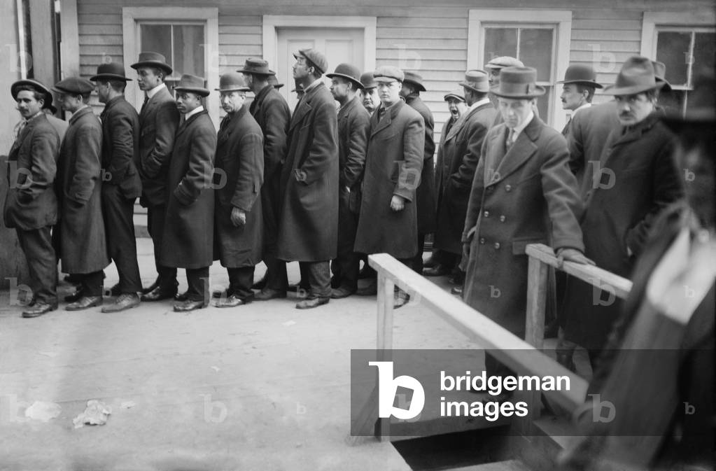 Multi-ethnic group of men waiting to apply for subway work in New York City, c. 1910. The underground rapid transit system opened with 22 miles of track in 1904 and throughout the city for the next 30 years. c. 1910