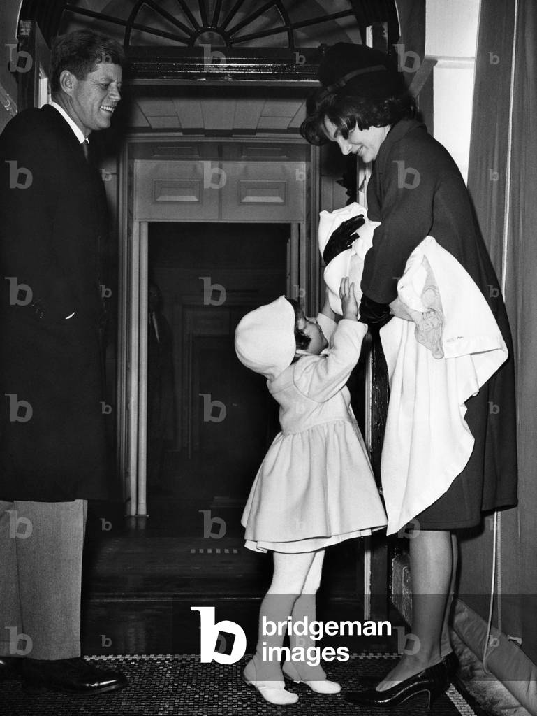 John F. Kennedy, Caroline Kennedy, Jacqueline Kennedy holding John F. Kennedy Jr., January, 1961