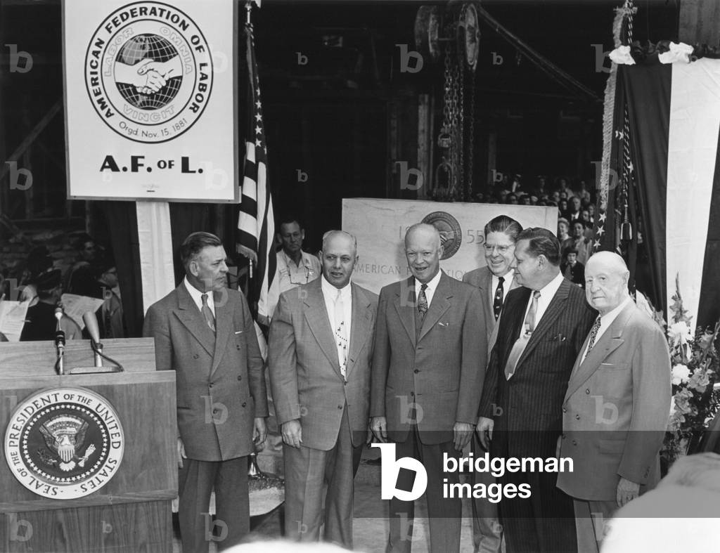 President Eisenhower with George Meany (left of DDE) and other officers of the AFL-CIO Labor Union. The President attended the cornerstone laying ceremony of the new American Federation of Labor Building with Sec. of Labor James Mitchell (standing behind Eisenhower).