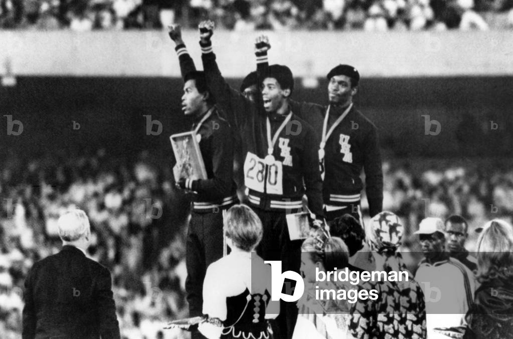 1968 Olympics, 4x100 Men's Relay Team gives 'Black Power' salute upon receiving Gold Medals. (L-R) Lee Evans, Ronald Freeman, Larry James, Vincent Matthews. Mexico City, Mexico, 10-20-1968.