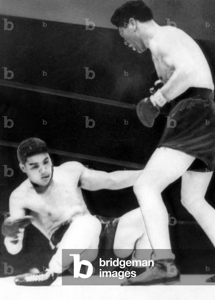 Max Schmeling defeats Joe Louis in 12 rounds, Yankee Stadium, 1936