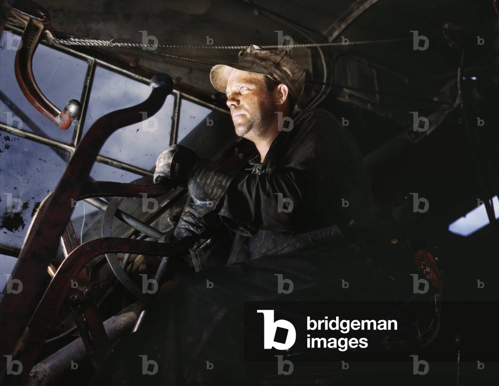 Crane operator at TVA's Douglas Dam, Tennessee. After U.S. entry into World War 2, construction on this dam was important to provide power for the defense industry. June 1942