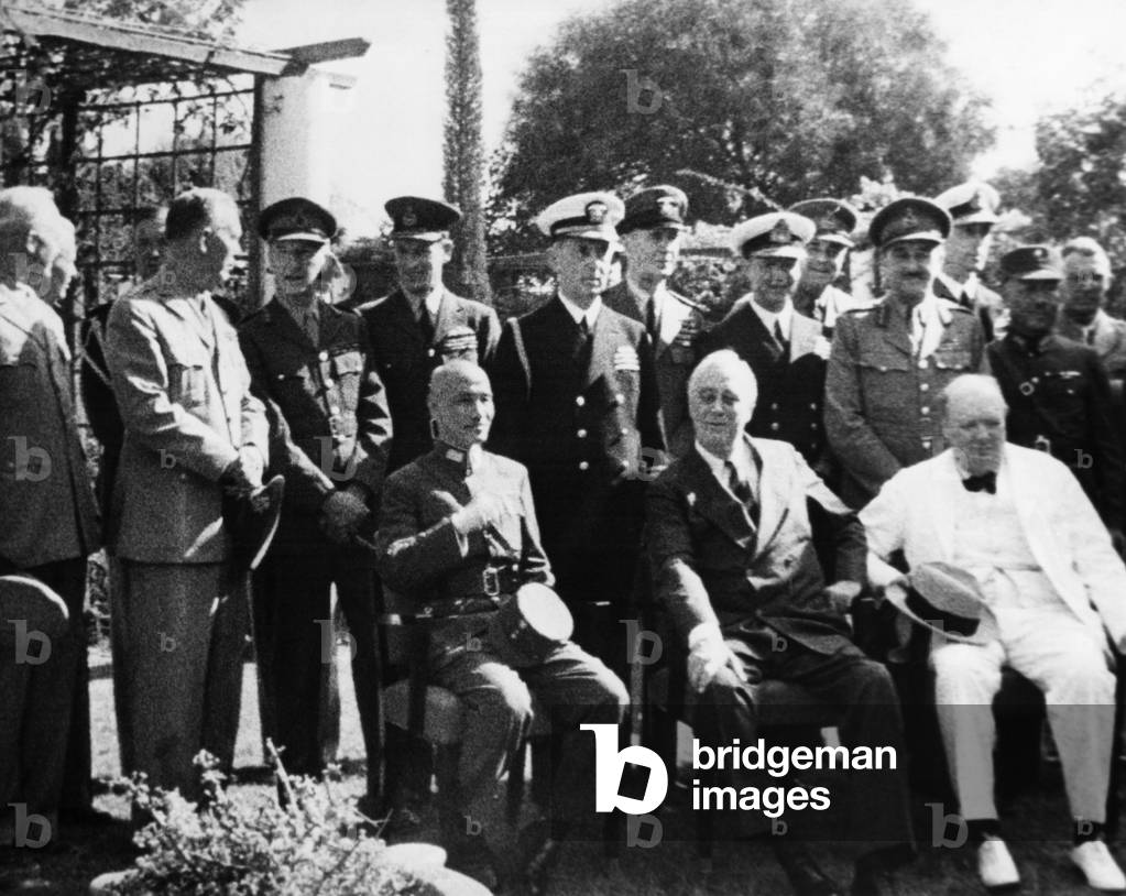 World War II. Seated, from left: Chiang Kai-shek, Franklin Delano Roosevelt, Winston Churchill. Standing, from left: H.H. Arnold, Brehon Somervell, Edwin Watson, George Marshall, John Dill, Charles Portal, William Leahy, Ernest King, Alan Brooke, Louis Mountbatten, He Yingqin, Joseph Stillwell, at the First Cairo Conference, Cairo, Egypt, November 1943