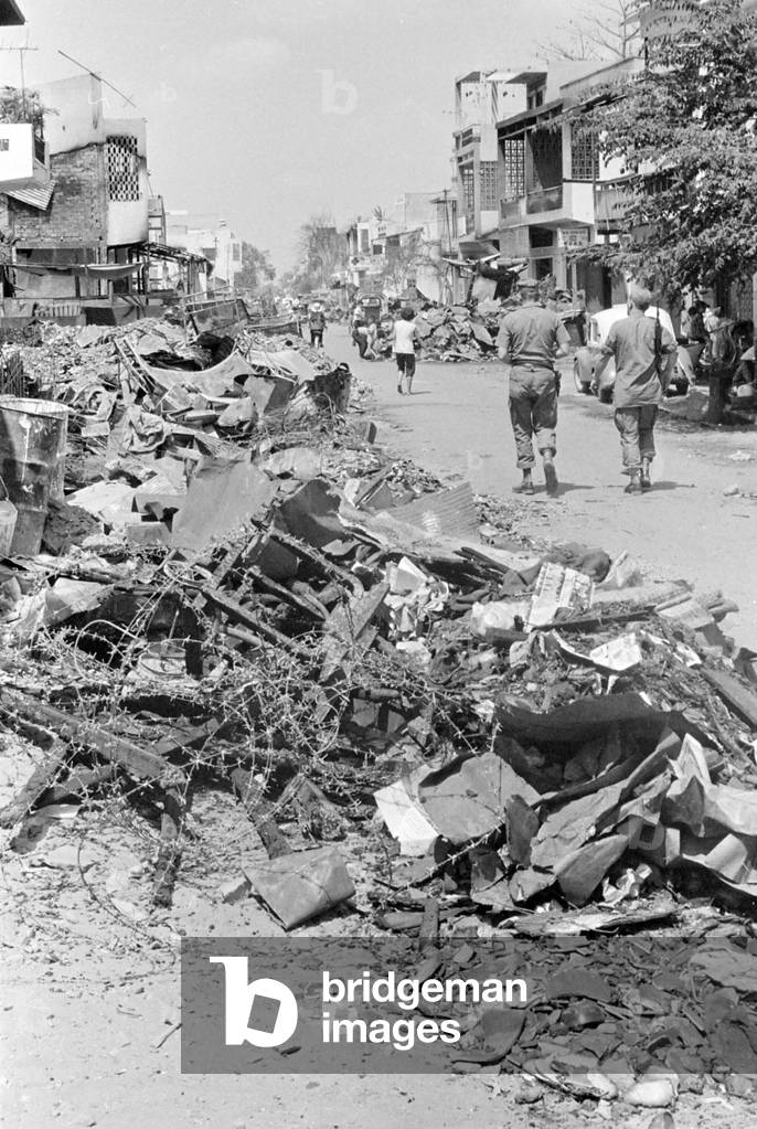 Vietnam War, Saigon, Vietnam, rubble and the remains of barbed wire line the streets of Cholon, a suburb of Saigon that was burned by South Vietnamese army troops in an effort to flush out any Viet Cong that remained after the Tet offensive, c.1968