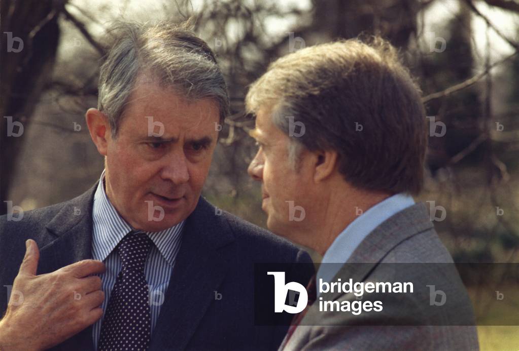 Secretary of State Cyrus Vance talks with President Carter on the White House lawn in March of 1977