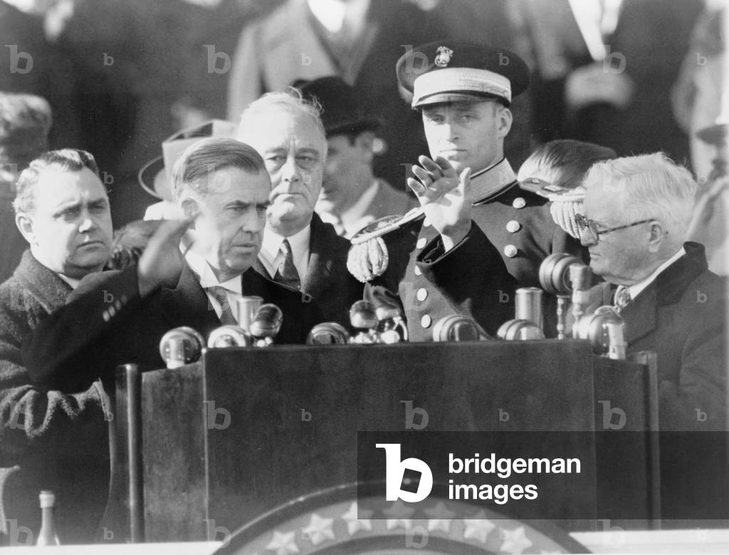 Vice President Henry Wallace (1888-1965) takes the oath of office from his predecessor, John Nance Garner, at the U.S. Capitol, January 20, 1941