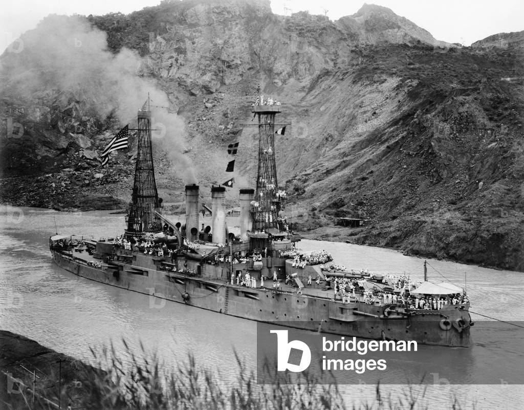 U.S.S. Ohio passing through the Panama Canal on July 16, 1915. The ship is passing the Cucaracha Slide, in the Culebra Cut, the eight mile long gorge carved through the continental divide