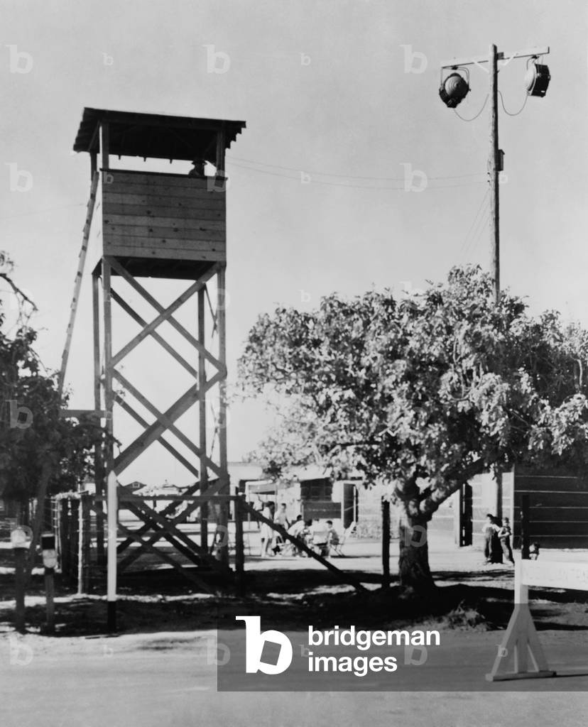 Guard tower and lights at Fresno, California, Assembly Center, where deported Japanese-Americans were first taken before routing to the relocation camps that would be their homes for the duration of World War II. 1942