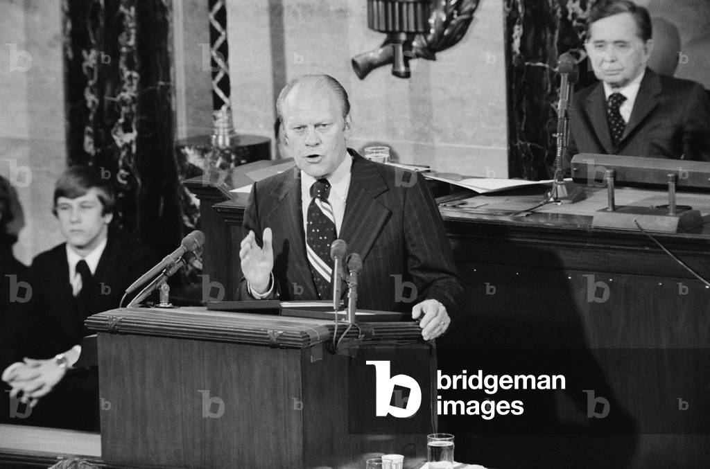 President Gerald Ford addressing Congress as Speaker of the House Carl Albert looks on. Oct. 8 1974