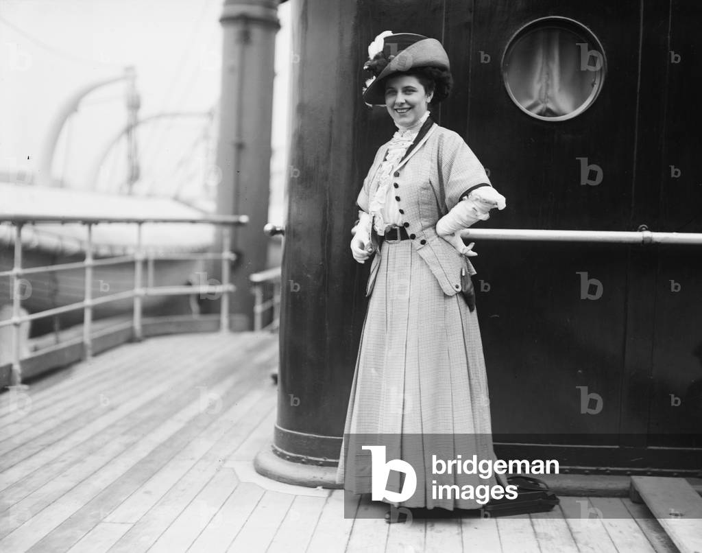Geraldine Farrar (1882-1967), poses for a news photographer aboard an Ocean Liner in New York. c. 1910