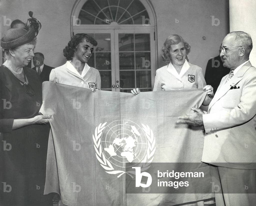 Eleanor Roosevelt and 4-H Club girls present Pres. Truman a UN Flag. Sept. 7, 1950