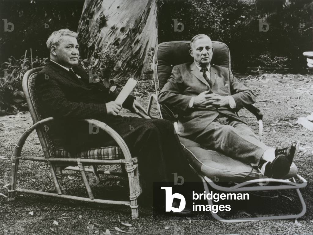 Allan Nevins (1890-1971)(right), and Henry Steele Commager (1902-1998), both eminent American historians, sitting in lawn chairs beneath a eucalyptus tree. 1963