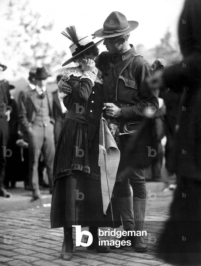 U.S. Soldier saying good bye to his weeping sweetheart. The 71st Regiment Infantry, New York National Guard, was leaving for Camp Wadsworth, Spartanburg, S.C., for basic training. World War I. 1917