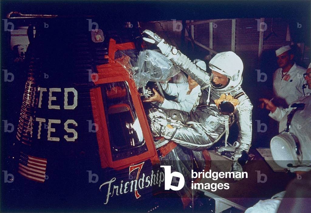 Overall view of astronaut John Glenn, Jr., (Lt. Colonel, USMC) as he enters into the spacecraft Friendship 7 prior to the first American manned Earth orbital mission. February 20, 1962