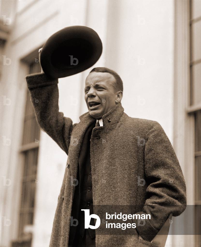 Theodore Roosevelt Jr. (1887-1944), greeting reporters with a big smile as he waves his hat. At times he would imitate his father, President Theodore Roosevelt, and shout bully. April 12, 1924