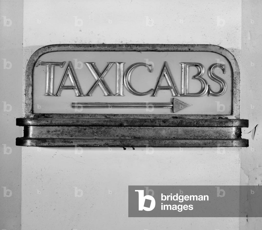 Los Angeles Union Passenger Terminal, detail of signage in reception hall, reads 'Taxicabs' with an arrow, 800 North Alameda Street, Los Angeles, California, photograph by Mark A. Bookspan, c.1970s