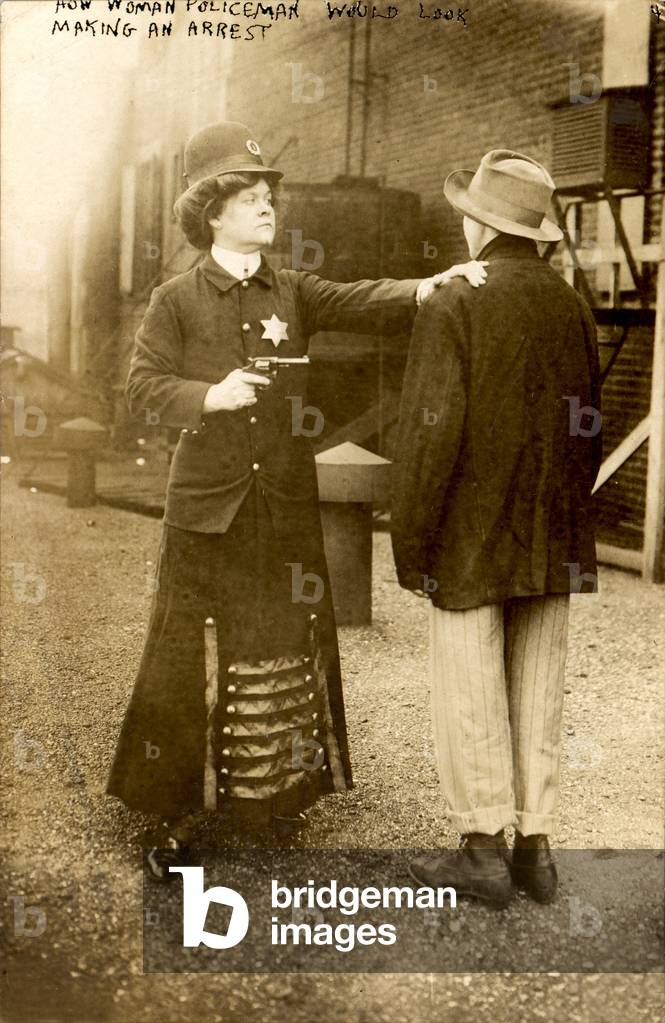 A woman behaving as a policeman, original title: 'How woman policeman would look making an arrest', September, 1909