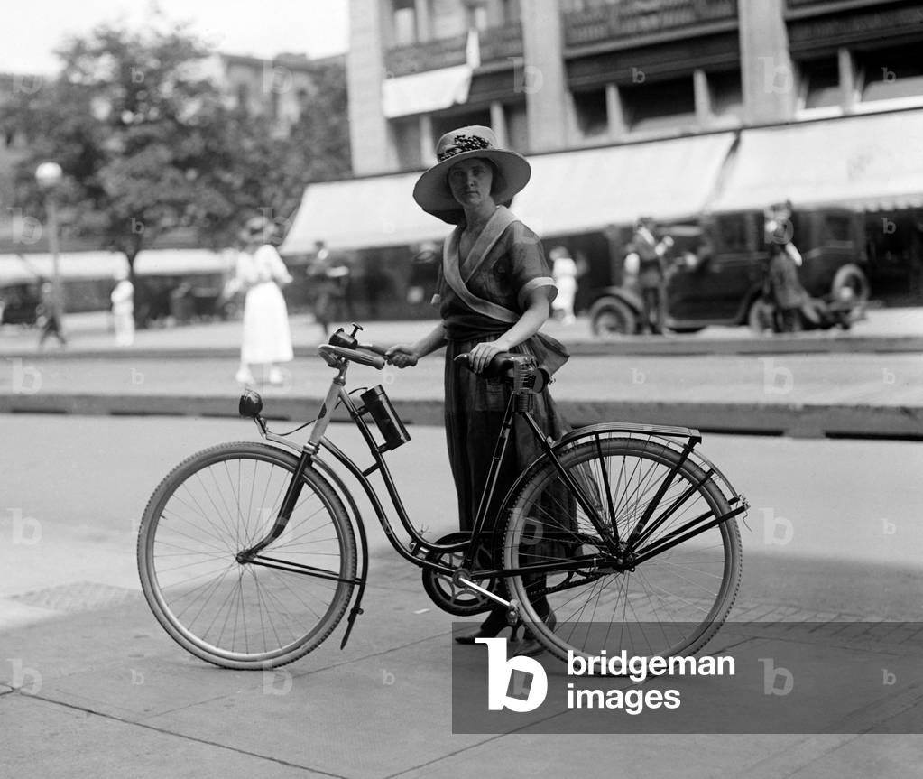 Bicycle. Times girl on bicycle, 1921