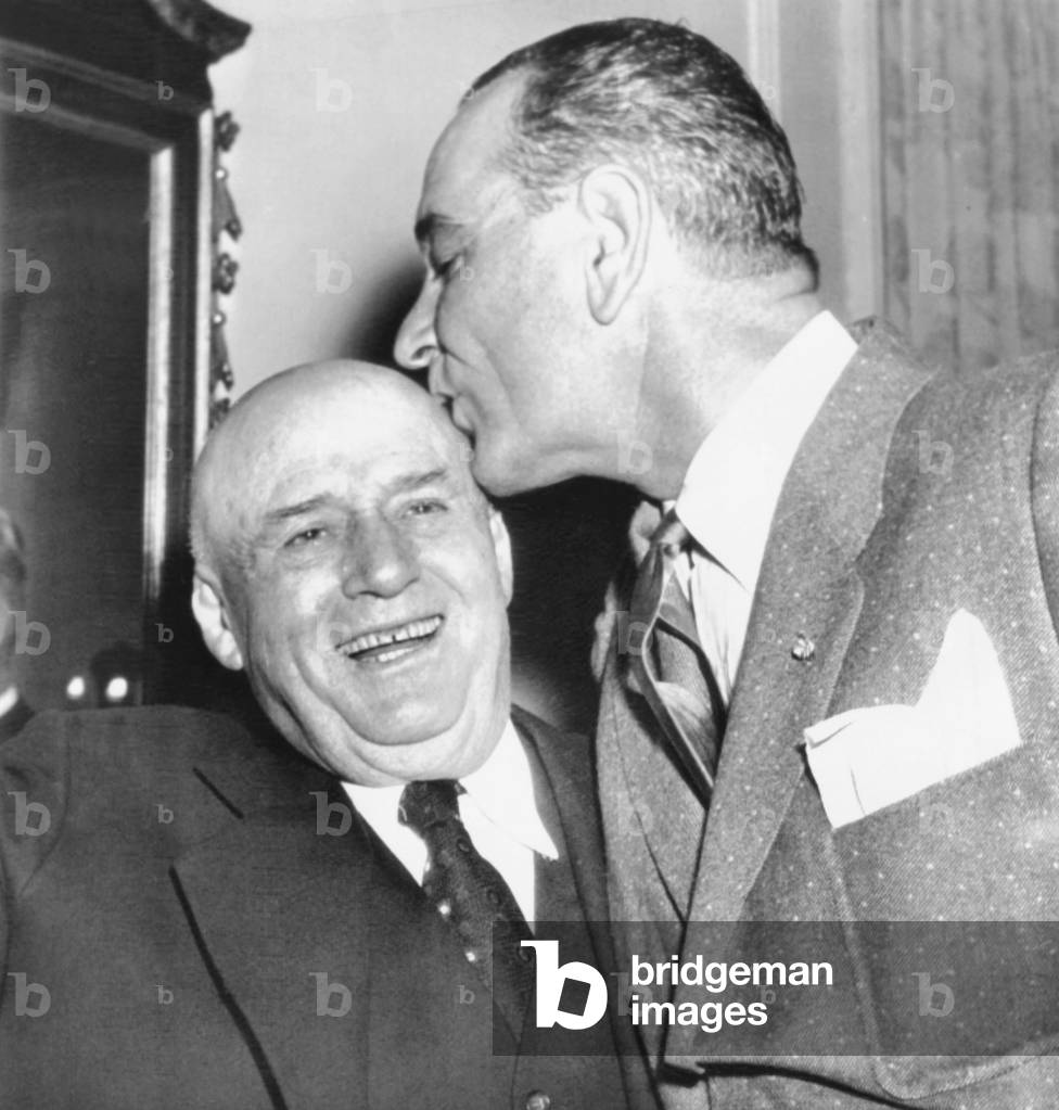 Speaker Sam Rayburn gets a kiss on the head from Senate Majority Leader Lyndon Johnson. Jan. 6, 1956. The two Texans Congressional leaders were celebrating Rayburn's 76th birthday